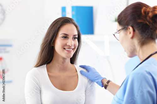 Adult woman having a visit at female doctor s office