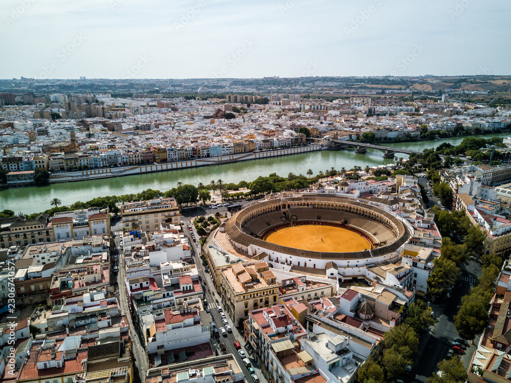 Fototapeta premium Aerial drone photo - Iconic bullfighting ring, Plaza de Toros, of Seville (Sevilla) Spain. 