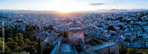 Aerial drone photo above The Alhambra Palace of Granada Spain at sunset. 