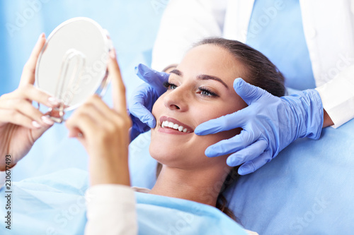 Adult woman having a visit at the dentist's photo