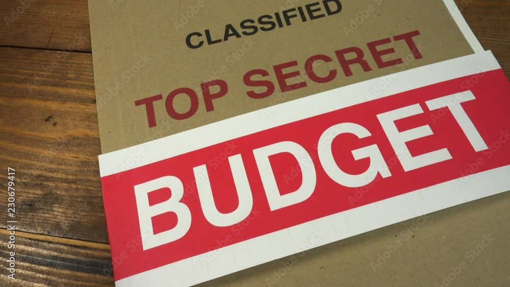 Breaking a BUDGET sealing strip from a top secret budget file. Secret budget. Breaking a BUDGET sealing strip from a top secret budget file. Secret budget.
