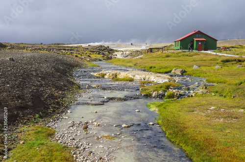 Hot steam coming from the boiling water in the central Iceland in the geothermal area of Hveravellir. photo