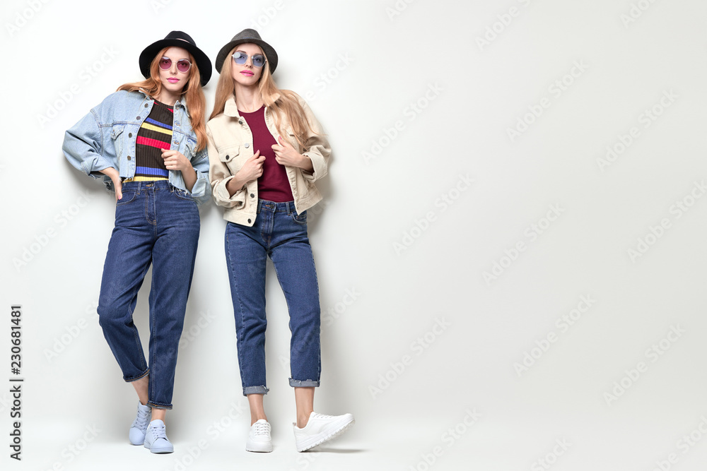 Two Girls Fooling Around. Fashion Autumn Outfit Two Girls Fooling Around. Fashion Autumn Outfit