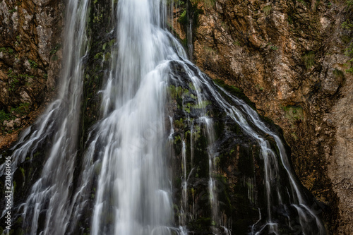 Beautiful view of famous Gollinger Wasserfall with mossy rocks and green trees  Golling  Salzburger Land  Austria