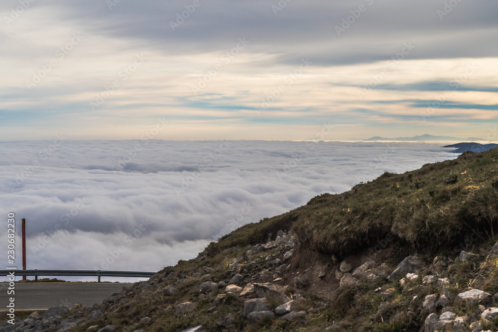 landscape of mountains at sunrise above the clouds, sea of clouds