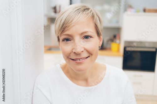 Attractive blond woman smiling at camera