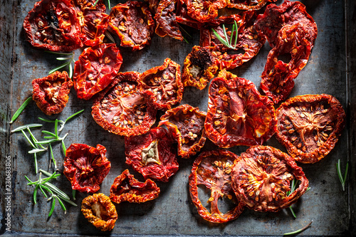 Delicious tomatoes dried in the sun on baking tray