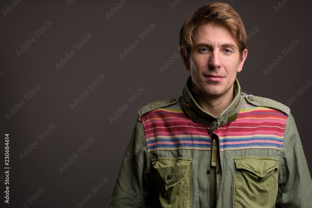 Portrait of handsome man against gray background Portrait of handsome man against gray background