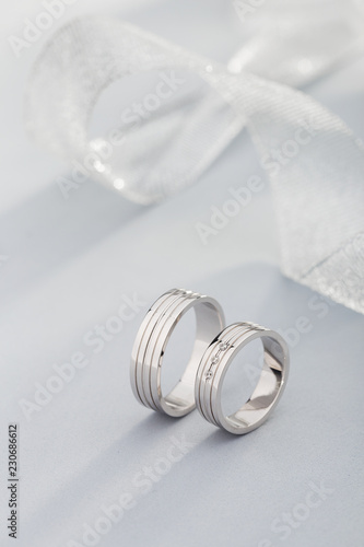 Pair of white gold wedding rings with diamonds in womens ring