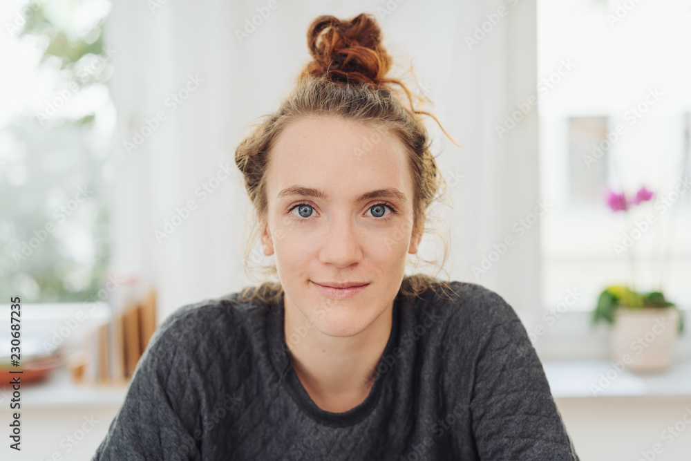 Attractive young woman staring intently at camera Attractive young woman staring intently at camera