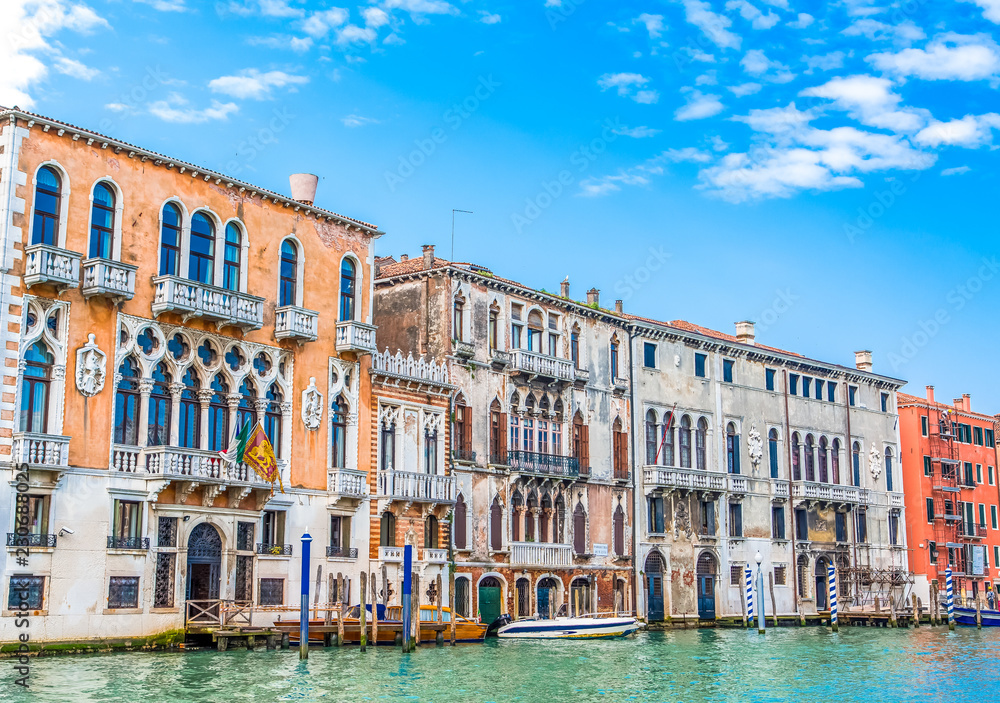 Naklejka premium Buildings and Boats Along Venice Canal
