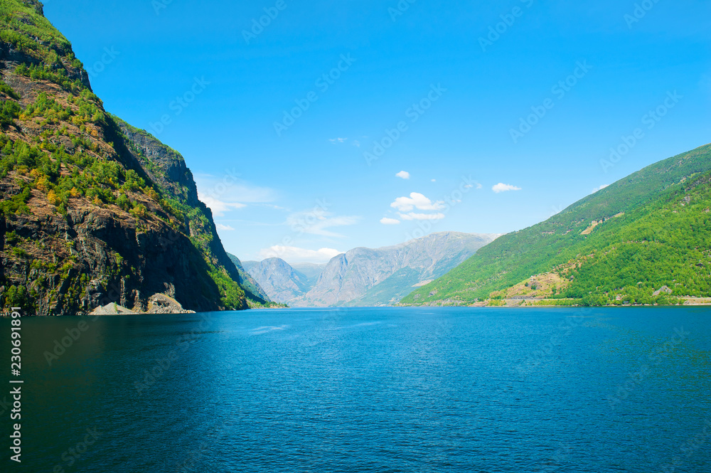 The Breathtaking Norwegian Aurlandsfjord and Naeroyfjord - UNESCO protected fjord - cruise from Flam to Gudvangen on Norway in a Nutshell Tour. Aurlandsfjord landscape.