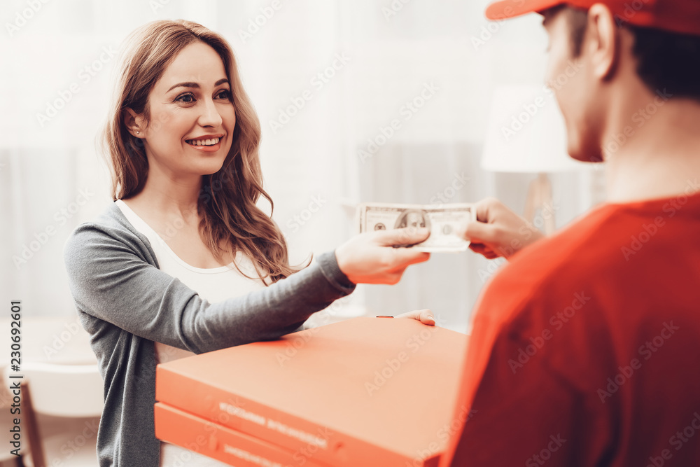 Smiling Woman with Courier Pizza Delivery Payment. Smiling Woman with Courier Pizza Delivery Payment.