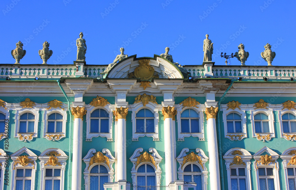 Winter Palace Building at Palace Square in Saint Petersburg, Russia. Facade Detail of Winter Palace with Russian Flag, Old Historic City Landmark Isolated on Empty Blue Sky Background on Summer Day