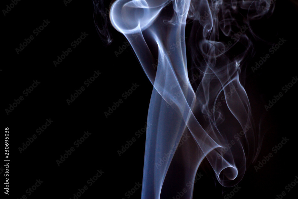 Thick smoke on a black isolated background. Background from the smoke of vape Thick smoke on a black isolated background. Background from the smoke of vape