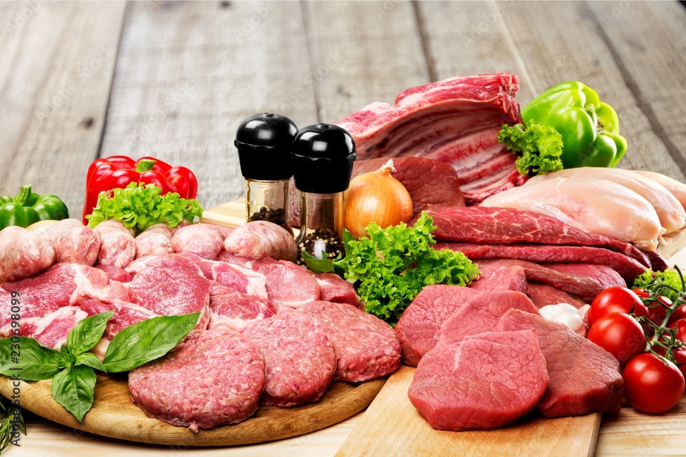Fresh Raw Meat Background with vegetables Fresh Raw Meat Background with vegetables