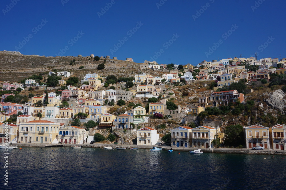 colored houses sуmi island greece