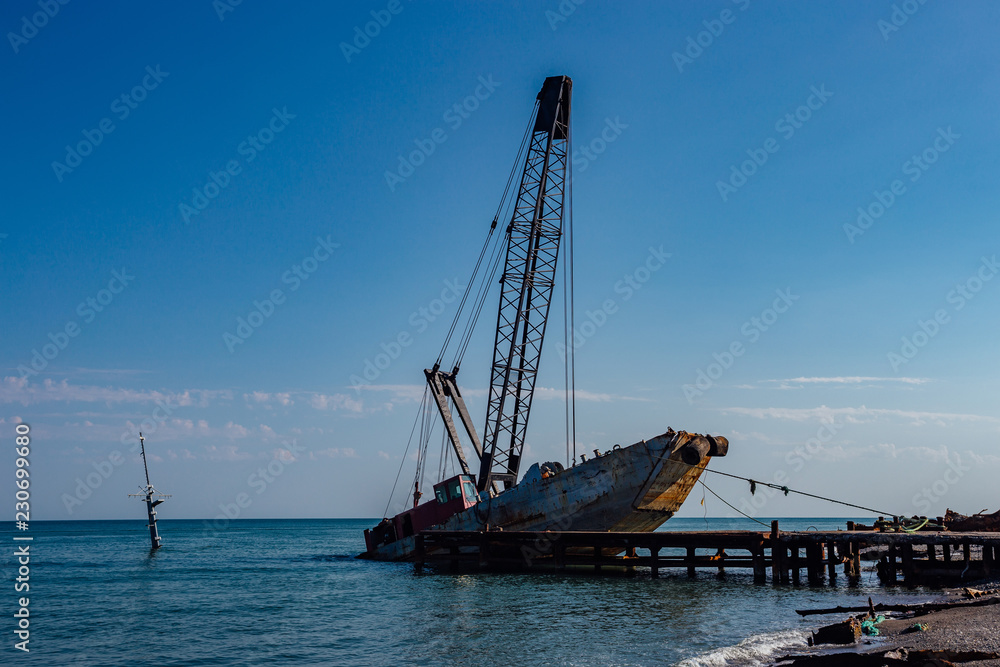 Abandoned shipwreck on black sea coast in Abkhazia