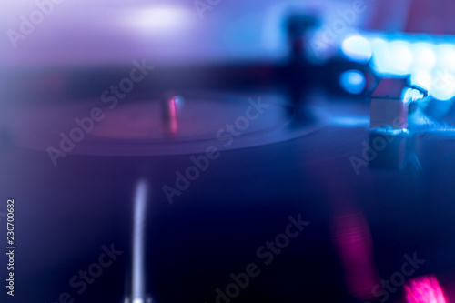 turntable and record under colored lights