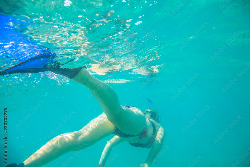 Tropical sea apnea snorkeling in Hawaii. Watersport activity in Hawaii. Tropical destination holiday travel.