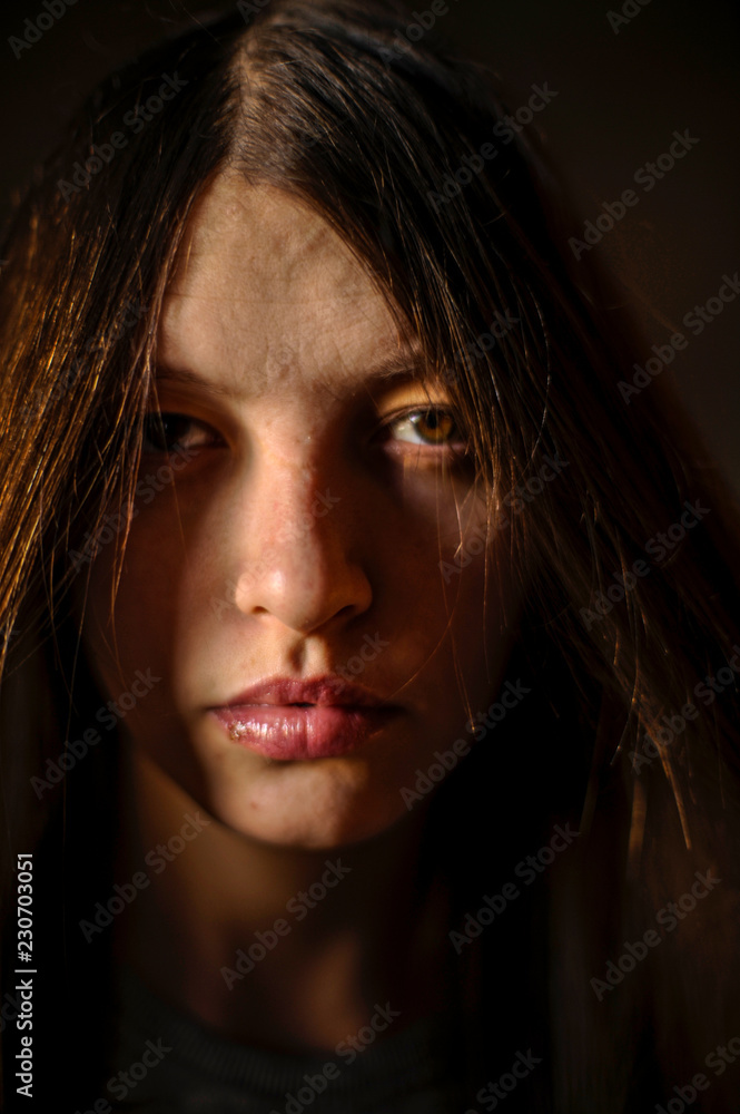 Beautiful girl with long hair like a witch poses for the camera on Christmas Eve Beautiful girl with long hair like a witch poses for the camera on Christmas Eve