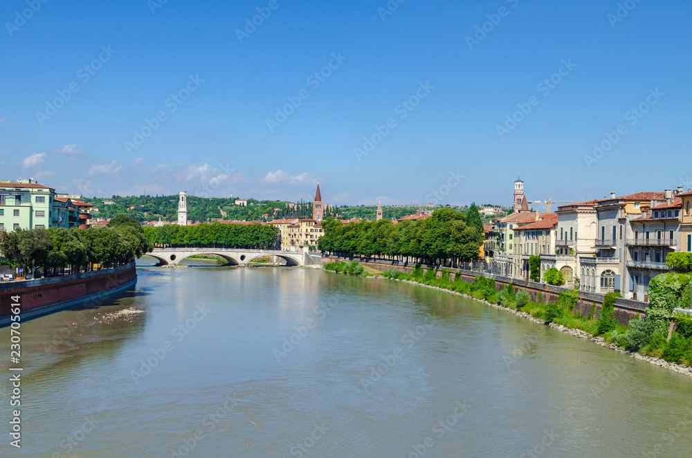 View from Castelvecchio bridge towards the Vittoria bridge crossing the river Adige in Verona, Italy