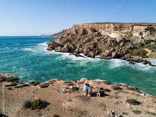 Obraz na płótnie Aerial drone photograph of waves crashing into the rugged coastline of Malta. Tiny island country in the Mediterranean Sea, Europe. w salonie