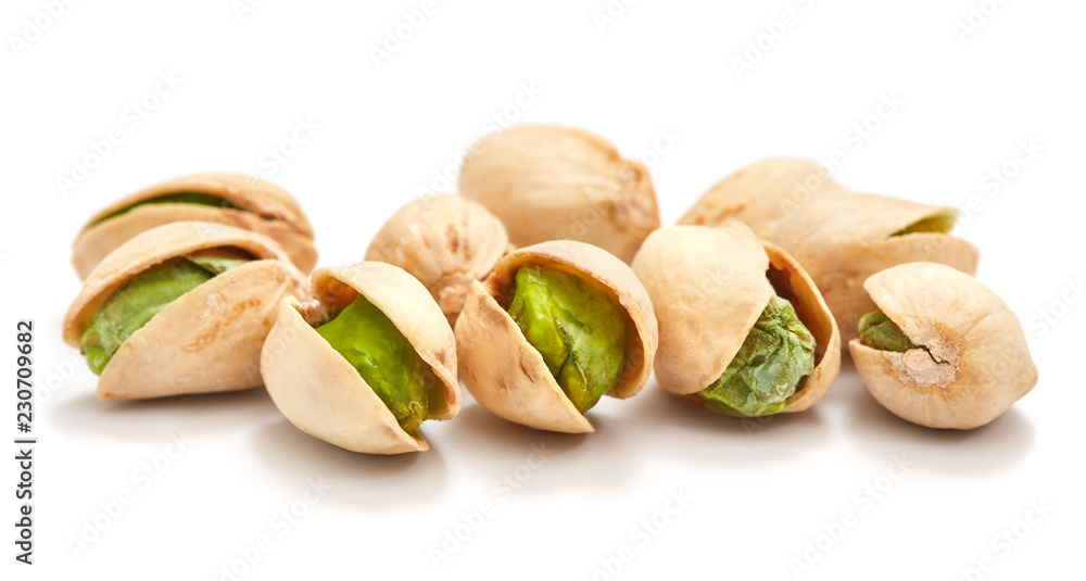 heap of ripe pistachios isolated on white background heap of ripe pistachios isolated on white background