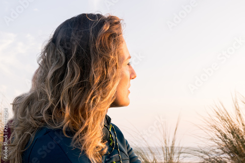 Woman relaxed with strong sunlight on face
