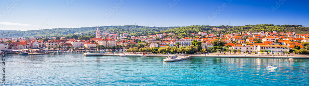 Harbour in Supetar town on Brac island with palm trees
