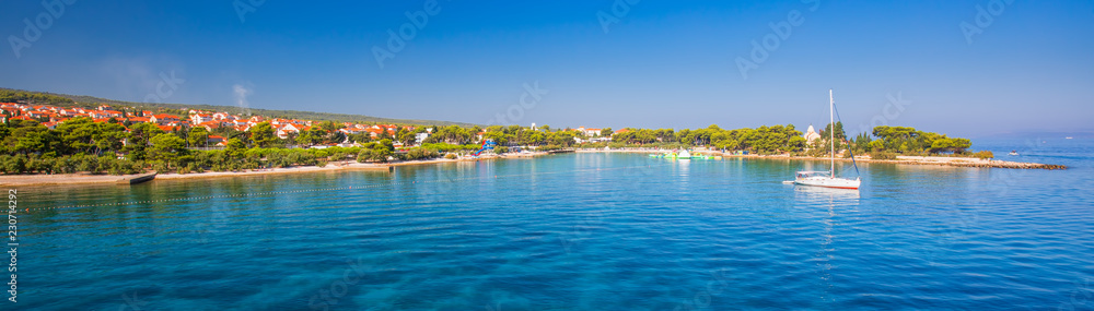 Harbour in Supetar town on Brac island with palm trees