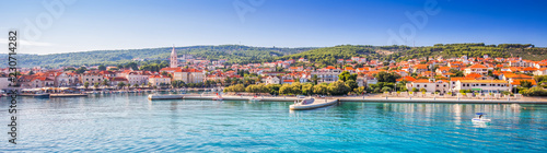 Harbour in Supetar town on Brac island with palm trees photo