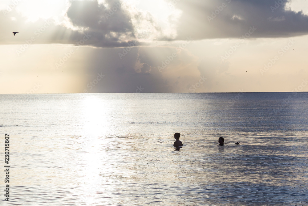 Fototapeta premium sunset at south beach with people enjoying the sea