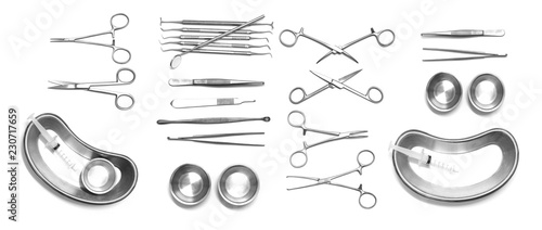 Collection of surgical instruments and tools including on white background photo