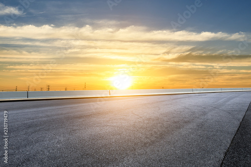 Empty asphalt road and beautiful sky scenery at sunset
