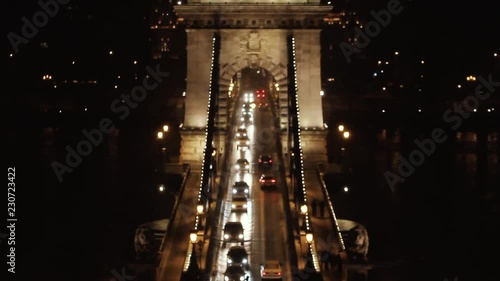 Traffic on Sz√©chenyi Chain bridge over Danube river, Budapest city, Hungary. Night scene photo