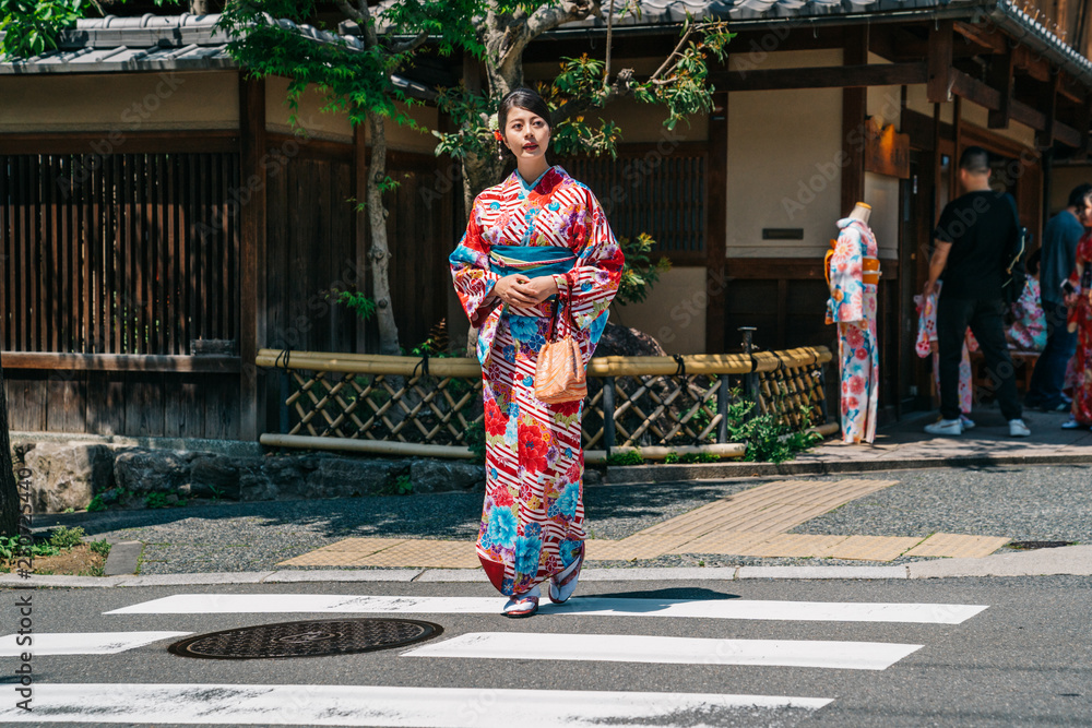 tourist walking out from the kimono store