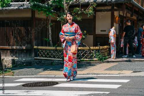 tourist walking out from the kimono store