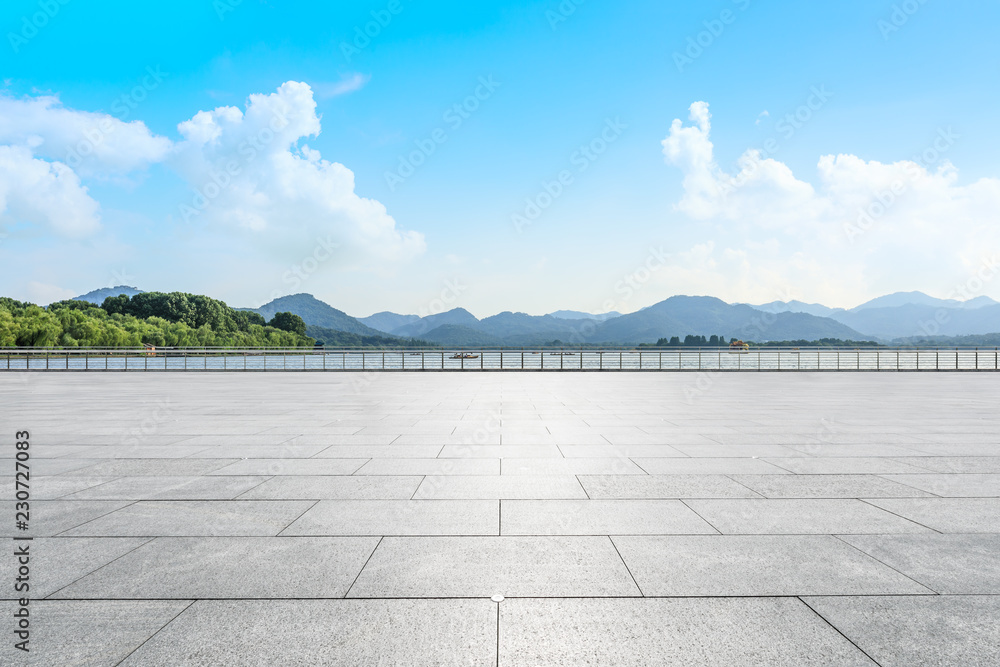Empty square floor and green mountain scenery