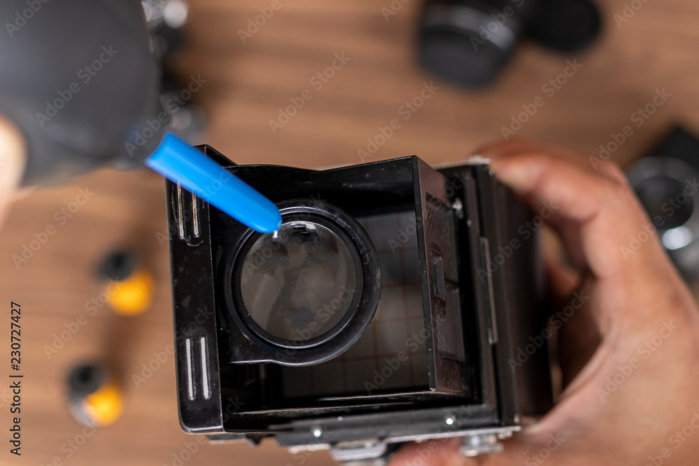 Performing cleaning of vintage photo camera