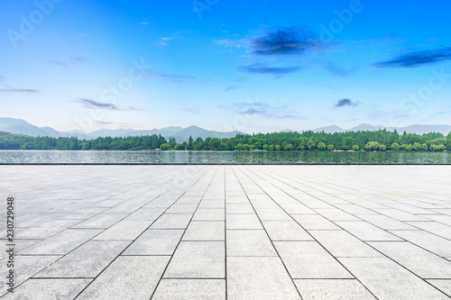 Empty square floor and beautiful mountain with lake