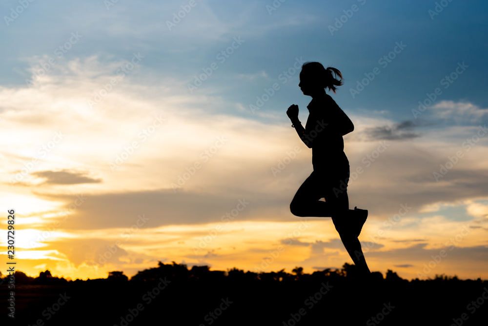 silhouette woman running alone at beautiful sunset in the park. silhouette woman running alone at beautiful sunset in the park.