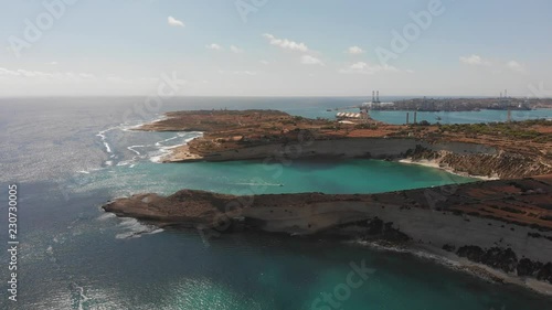 Aerial drone video from eastern Malta, Marsaxlokk area, Il-Hofra l-Kbira bay. photo