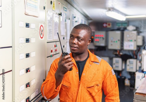 Fotografie African marine engineer officer in engine control room ECR