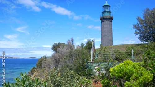 The Black Lighthouse of Queenscliff, Victoria. Gimbal lift to reveal the lighthouse from a green shrub. photo