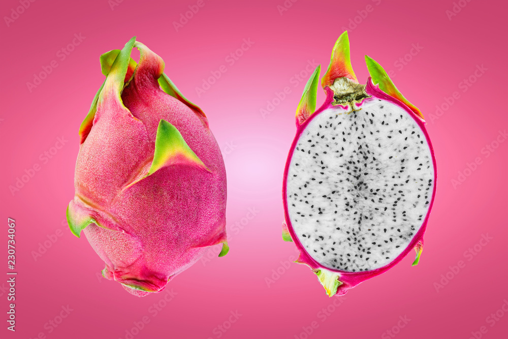 dragon fruit or pitaya sliced half isolated on pink background