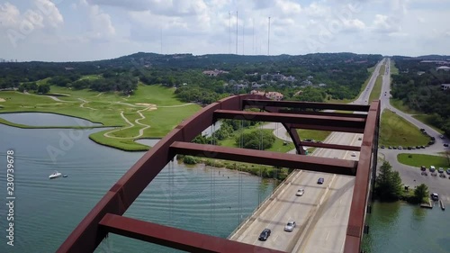 Passing over the Pennyback bridge in Austin, Texas ending with a top down view of Lake Austin photo