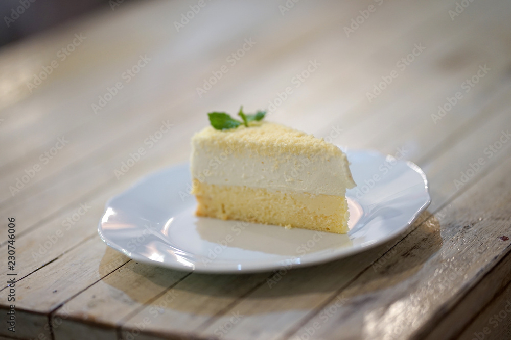 Homemade lemon cheese cake on light timber table Homemade lemon cheese cake on light timber table