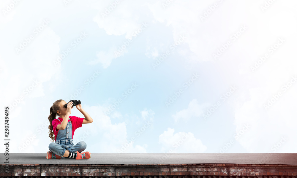 Concept of careless happy childhood with girl of school age looking in future Concept of careless happy childhood with girl of school age looking in future