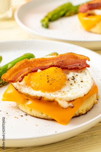 fried egg with bacon and cheese on pancake